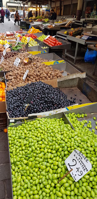 Athens: Traditional Greek food tour in hidden spots - Neighborhood stroll with snack stops: fish, spice, and everyday life