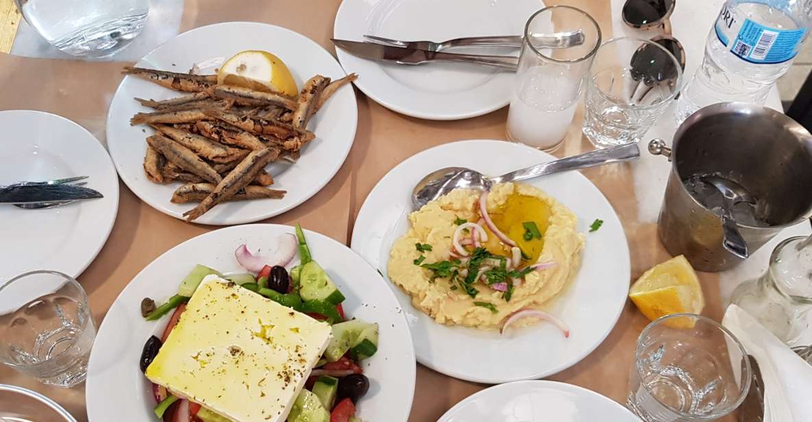 Athens: Traditional Greek food tour in hidden spots - Market lanes: fish, meat, fruit, and spices that explain the menu