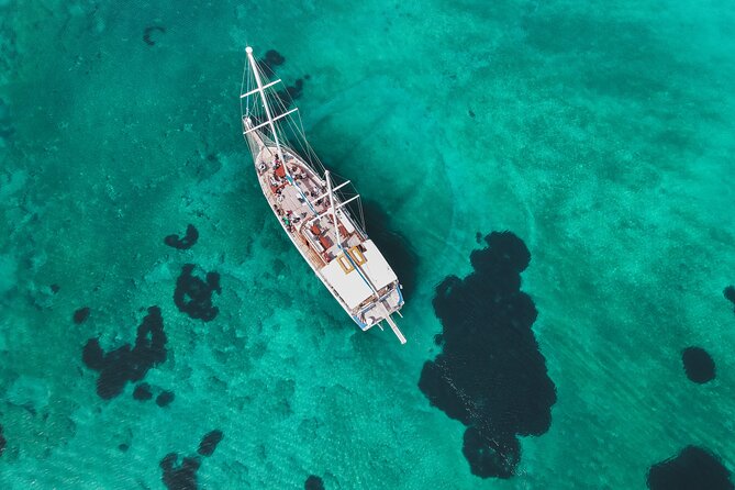 Sunset Dinner Cruise: Sunset, Swim, Drinks, and Dinner Onboard - How the two swim stops shape the whole experience