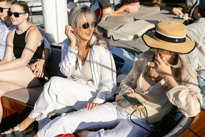 Sunset Dinner Cruise: Sunset, Swim, Drinks, and Dinner Onboard - Vouliagmeni at golden hour: your second swim and best sea light