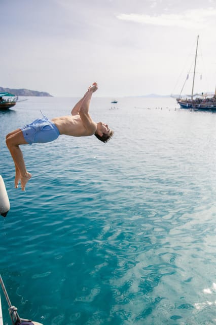Sunset Dinner Cruise: Swim Stop, Drinks & Onboard Dining - Sailing the Athenian Riviera: from Bay of Zea out toward Vouliagmeni